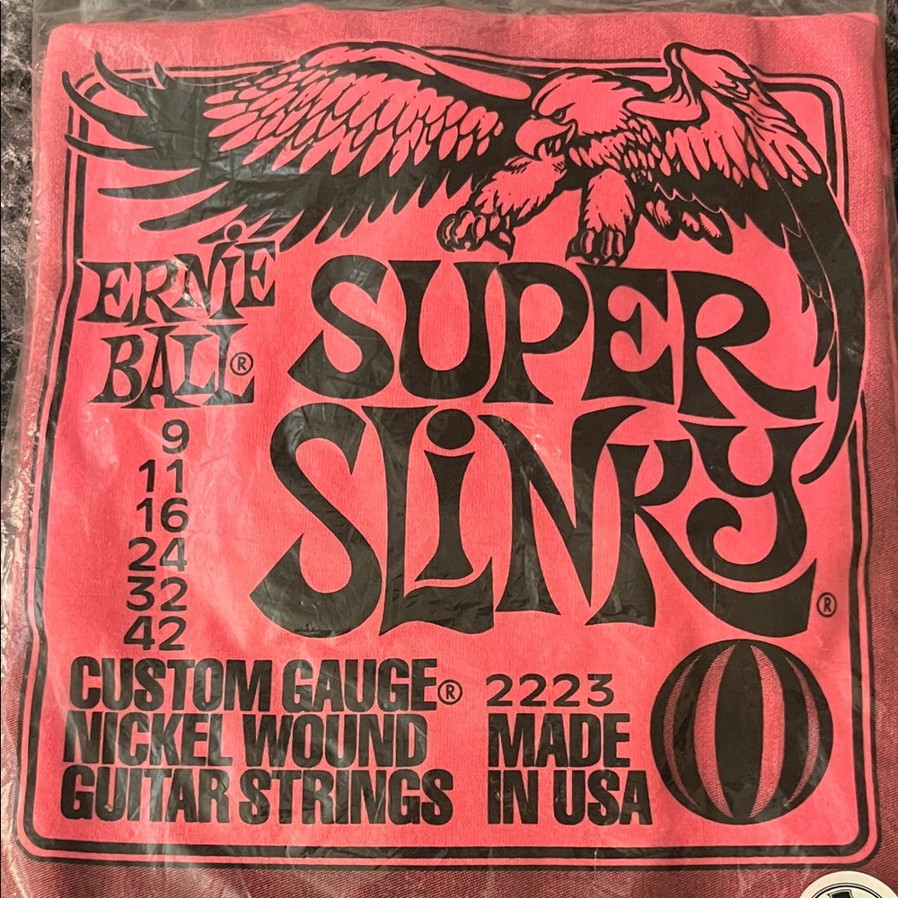 Ernie Ball Super Slinky Guitar Strings shirt sleeve t-shirt. Original packaging